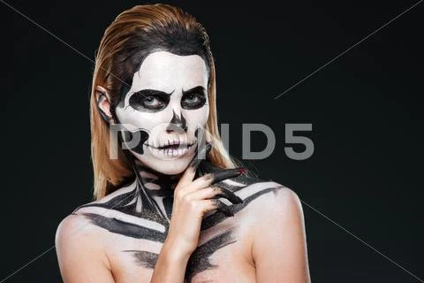 Young woman with gothic skeleton makeup Stock Photos