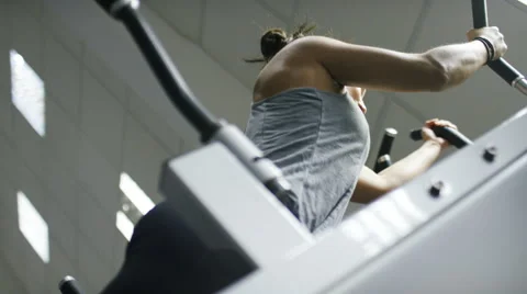 Young woman in the gym doing pull ups on a bar, in slow motion Stock Footage 59741774