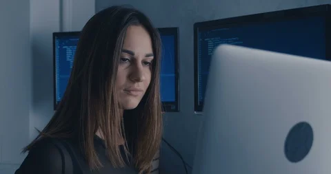 Young Woman Hacker Programmer working on computer at night Stock Footage 101629104