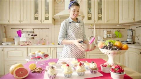 Young woman having fun while cooking Stock Footage 62746728