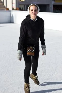 Young woman having fun while ice skating Foto stock