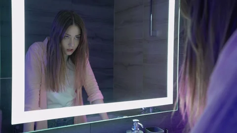 Young woman having panic attack near mirror, regret emotions, breakup depression Stock Footage 121247903