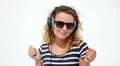 Young Woman with Headphones against White Background. Slow Motion. HD Footage