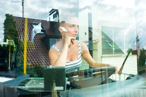 Young woman in her function as a bus driver Stock Photos