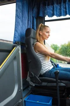 Young woman in her function as a bus driver Foto stock