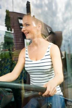 Young woman in her function as a bus driver Stock Photos