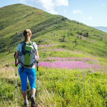 Young woman hiking in the mountains Stock Photos