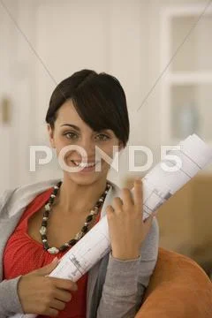 Young woman holding blueprints Stock Photos