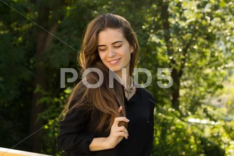 Young woman holding her hair Stock Photos