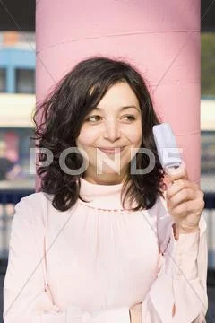 A young woman holding an ice-cream on a stick Stock Photos