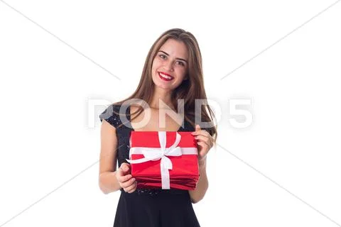 Young woman holding a present Stock Photos
