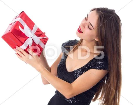 Young woman holding a present Stock Photos