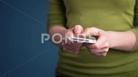 Young woman holding smarthphone in hand Stock Photos
