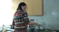 Young woman at home making tea and arguing HD Footage