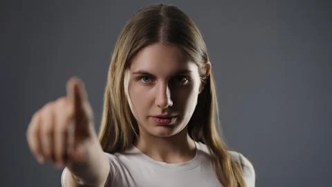Young woman interacting with virtual interface by pointing Stock Photos