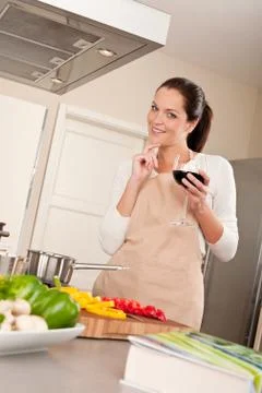 Young woman in the kitchen Stock Photos