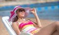 The young woman lay on the background the sea Photo