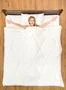 The young woman lay on the bed and gesture. View from above Photo