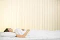 The young woman lay on the bed and smile Photo
