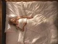 The young woman lay on the bed. View from above Photo