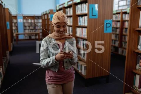 Young woman in library Stock Photos