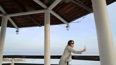 The young woman at the lighthouse. developing hair.slow motion Stock Footage 75388245