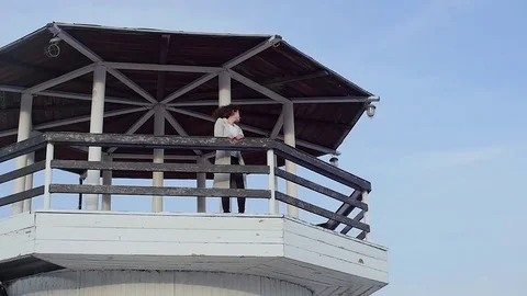 The young woman at the lighthouse. developing hair.slow motion Stock-Footage 75389459