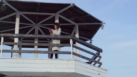 The young woman at the lighthouse. developing hair.slow motion Stock-Footage 75390361