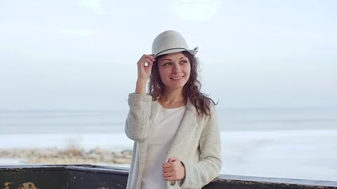 The young woman at the lighthouse. developing hair.slow motion Stockbeeldmateriaal 75486056