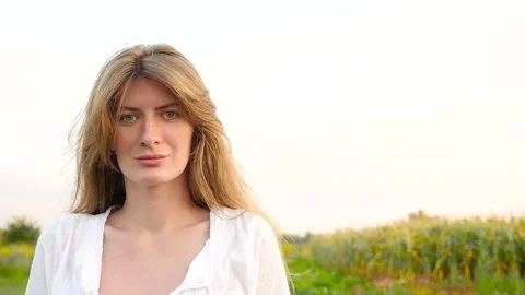 Young woman looking at camera Stock Footage 70819844
