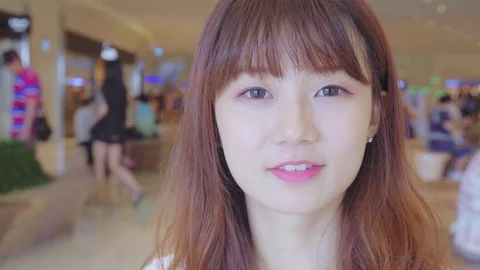 Young woman looking at camera Stock Footage