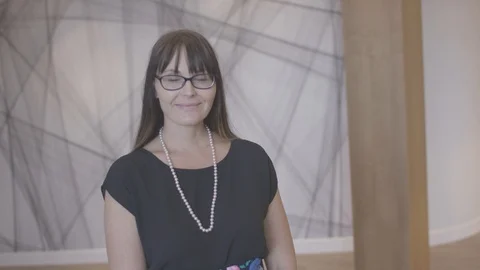 Young woman looking at camera posing and engaged in small business company Video stock 94233649