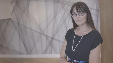 Young woman looking at camera posing and engaged in small business company Stock Footage 94233845