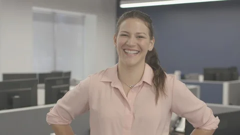 Young woman looking at camera posing and engaged in small business company Stock-Footage 94234529