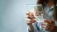 A Young Woman Is Looking At A Stock Chart Or A Large Clip Of Currency Through Stock Photos