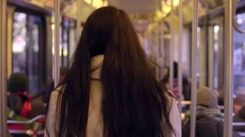 Young Woman Looks For A Seat On A Train Stock Footage
