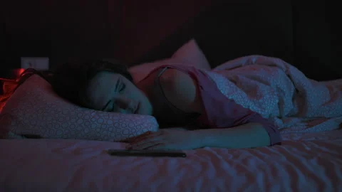 Young Woman Lying On Bed Using Smartphone Texting On Social Media Browsing Stock Footage 154151686