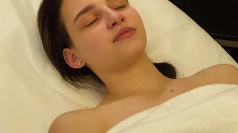 Young woman lying down during massage procedure Stock Footage 337666026
