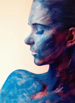 Young woman with make-up with blue paint and white powder Stock Photos