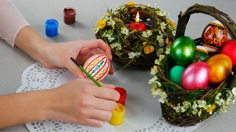 Young woman make a paint on easter egg Stock Footage 87857125