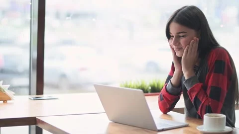 Young woman makes faces while communicating on video Stock Footage 141915535