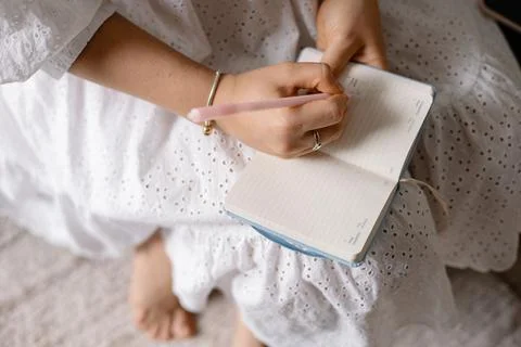 Young woman making notes in a notepad Stock Photos