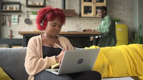 Young woman, man using wireless devices for self study and remote work at home Stock Footage 165579502