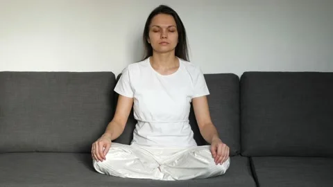 Young Woman Meditating in Lotus Position 4K Stock Footage
