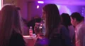 Young woman in night club drinking cocktails near the bar HD Footage