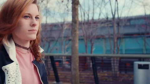 Young woman noding a camera in slow montion Stock Footage 73338001