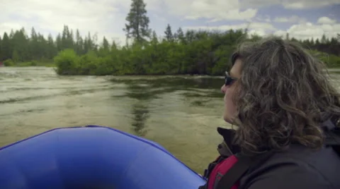 Young Woman nods in enjoyment while she white water rafts Stock Footage 59737569