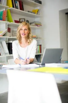 Young woman in the office Stock Photos