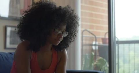 Young Woman Opens Package from Amazon Stock Footage 111159577