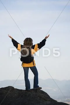Young woman overlooking her surroundings Stock Photos